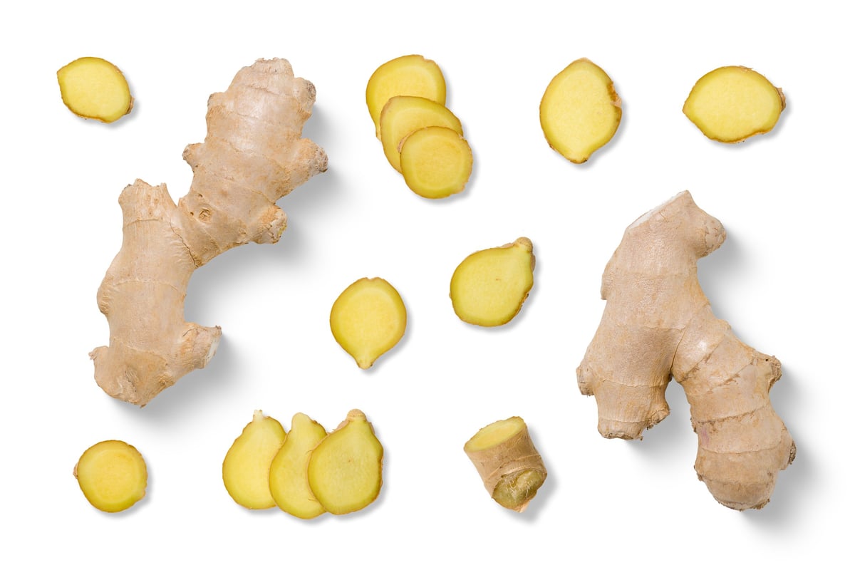Fresh ginger root and sliced ginger pieces